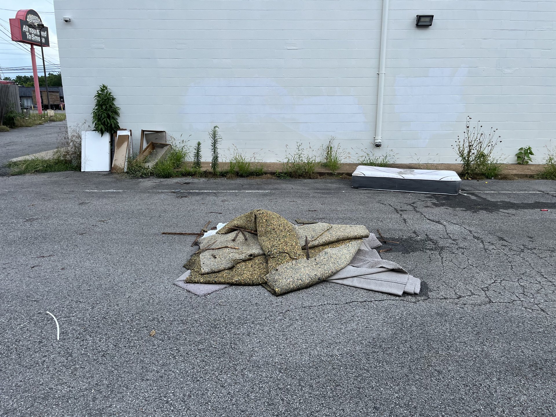 Commercial junk including a mattress, carpet, and renovation scrap