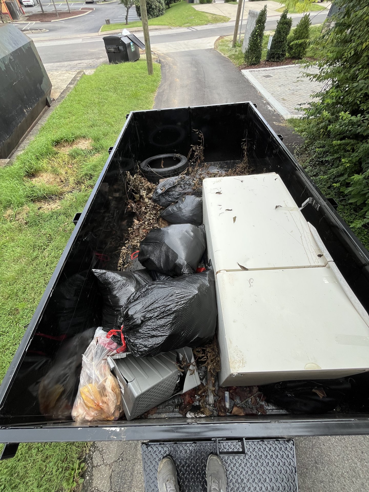 Refrigerator and household junk loaded in the trailer